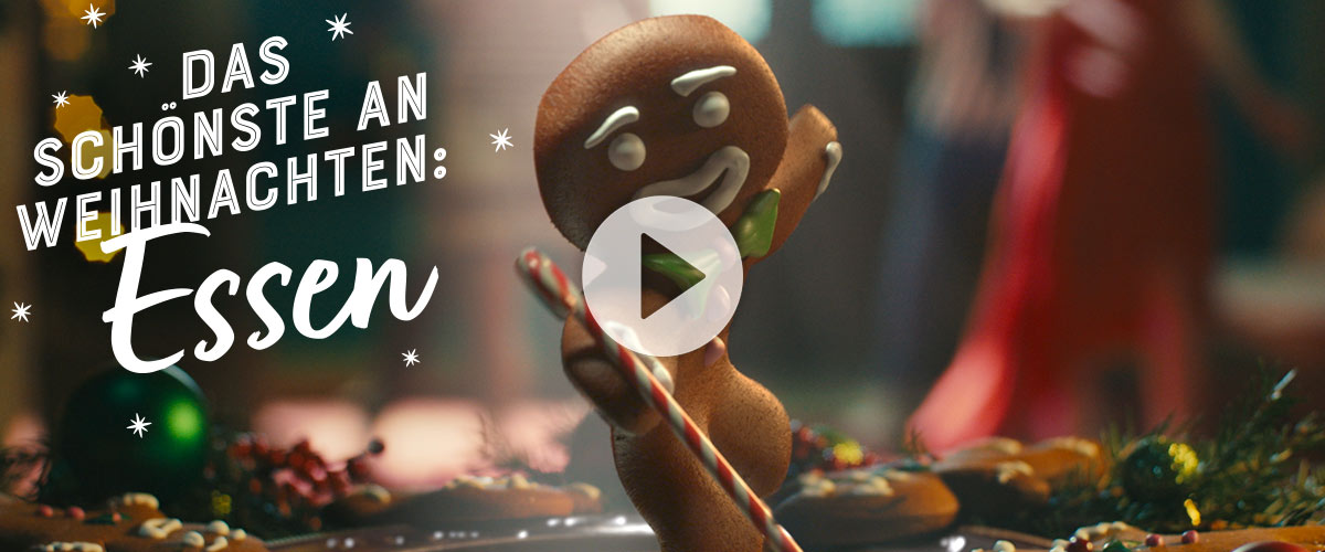Abbildung: tanzendes Lebkuchenmännchen; Play-Zeichen; Schriftzug: Das Schönste an Weihnachten: Essen