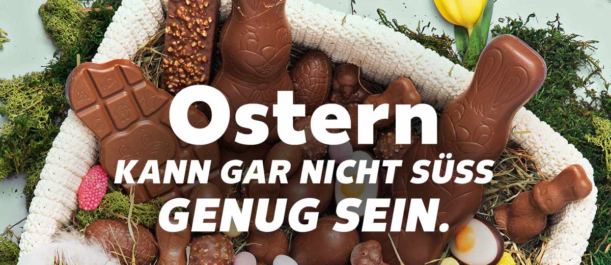 Schriftzug: Ostern KANN GAR NICHT SÜSS GENUG SEIN.; Abbildung: Osternest mit Schokolade