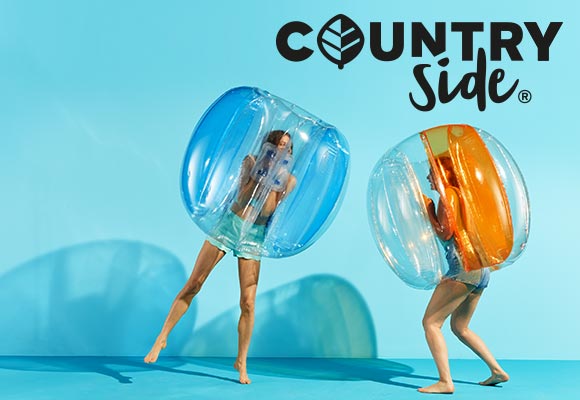 Logo: COUNTRYSIDE®; Abbildung: Zwei Frauen in Bubble Balls 