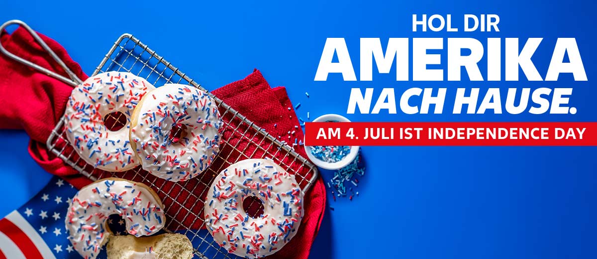 Schriftzug: HOL DIR AMERIKA NACH HAUSE. AM 4. JULI IST INDEPENDENCE DAY; Abbildung: Mehrere Donuts auf einem Backofengitter