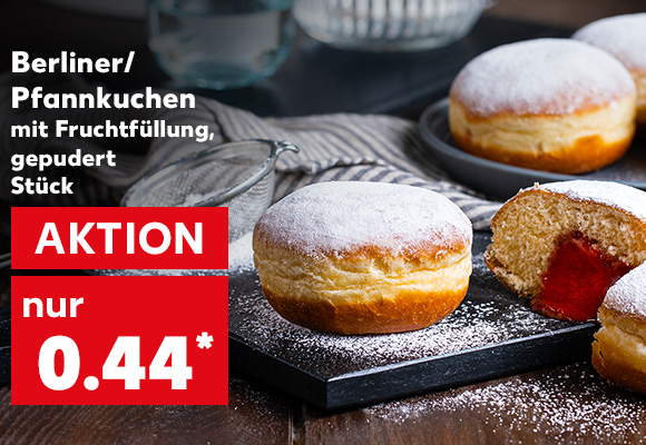 Berliner/Pfannkuchen mit Fruchtfüllung, gepudert, Stück für 0.44 Euro*; Abbildung: Berliner/Pfannkuchen gepudert auf einem Teller