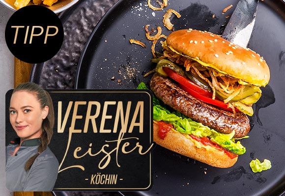 Abbildung: Burger auf einem schwarzen Teller; Abbildung und Logo: Verena Leister - Köchin -; Schriftzug: Tipp