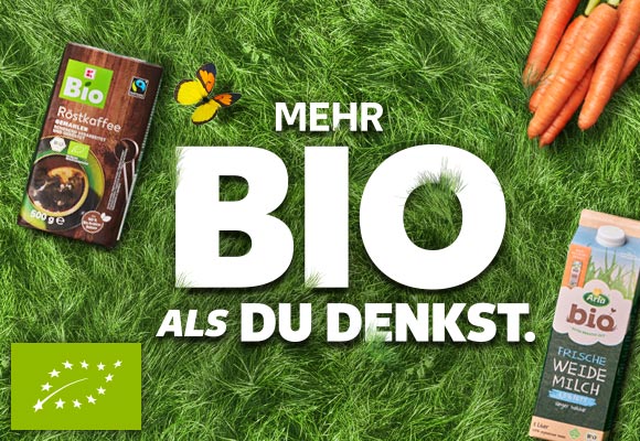Schriftzug: Mehr Bio als du denkst.; Abbildung: Verschiedene Bio-Produkte auf einem Rasen; Logo: Eu-Bio
